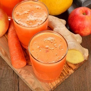 Comment préparer le jus de pommes et de carottes à partir d'un presse-agrumes pour l'hiver