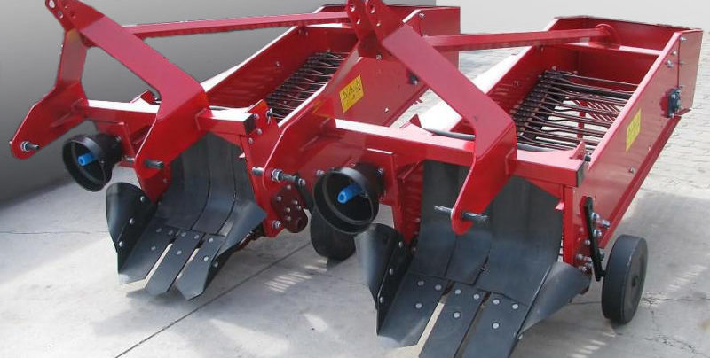 Types de pelleteuses de pommes de terre pour un mini-tracteur, principe de fonctionnement et critères de sélection